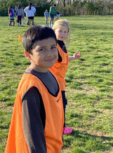 Two youth soccer players looking at camera during a break in the game