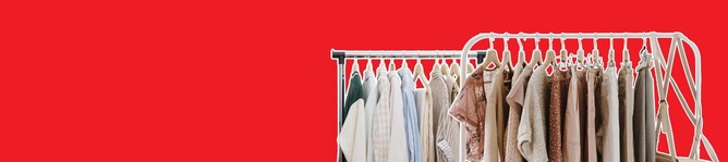 Clothing rack in a retail store, symbolizing optimized physical space, layout, and merchandising for converting browsers into buyers.